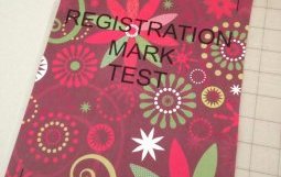 Thick registration marks on dark patterned paper on cutting mat