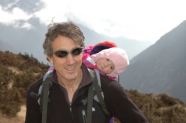 Layered synthetic fabrics keep me and my baby girl warm in the Himalayas. Photo © Liesl Clark