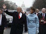 The Secret Service agent's appears to be holding his hands in a distinctive pose as he escorts President Trump and the First Lady down Pennsylvania Avenue